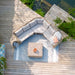 Bird's eye view of the Barakaldo Natural Antique Outdoor Corner Sofa Set, perfectly placed on a wooden deck surrounded by lush greenery