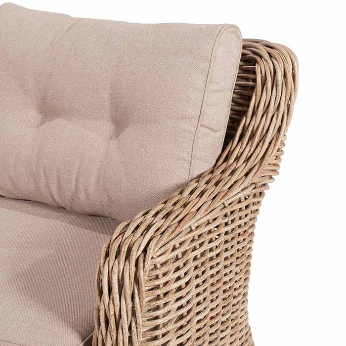 Detailed view of the Barakaldo Natural Antique Outdoor Seating Set's sofa armrest, highlighting the natural bamboo rattan weave and beige cushion.