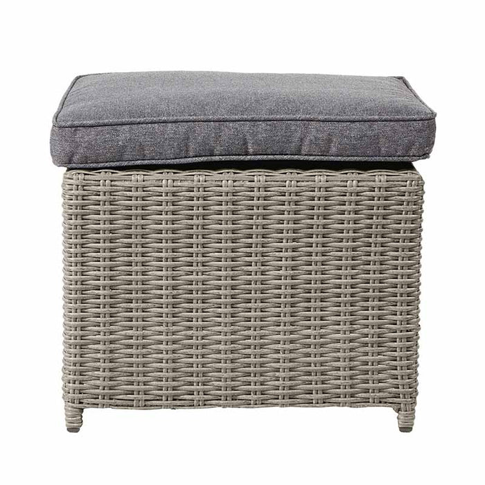 Close-up of a footstool from the Stone Grey Bermuda Set With Ceramic Top, featuring the cushion and wicker detail.