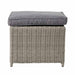 Close-up of a footstool from the Stone Grey Bermuda Set With Ceramic Top, featuring the cushion and wicker detail.