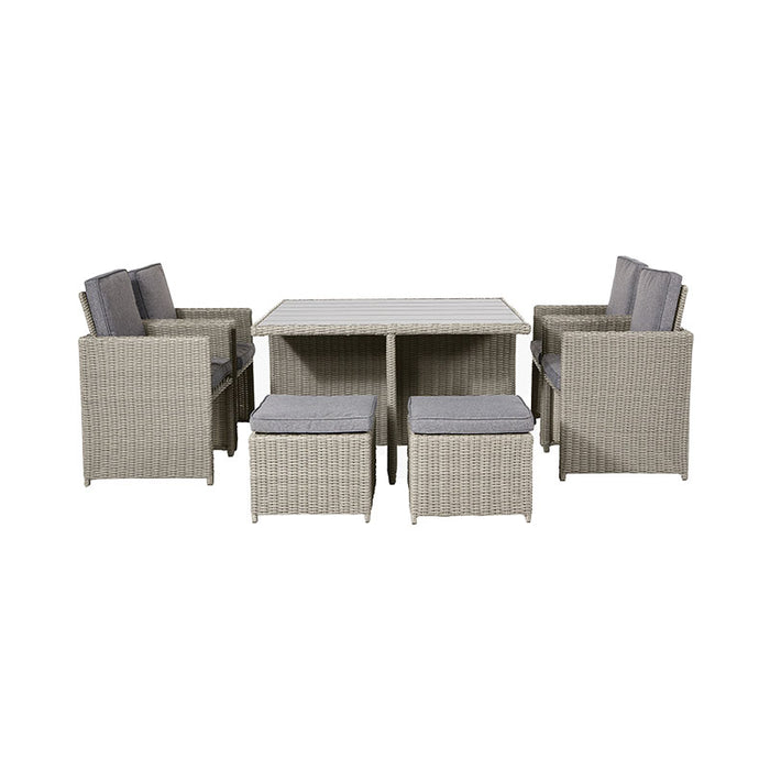 Front view of the Bermuda Cube Set in Stone Grey, showcasing four chairs and four footstools around the table. 