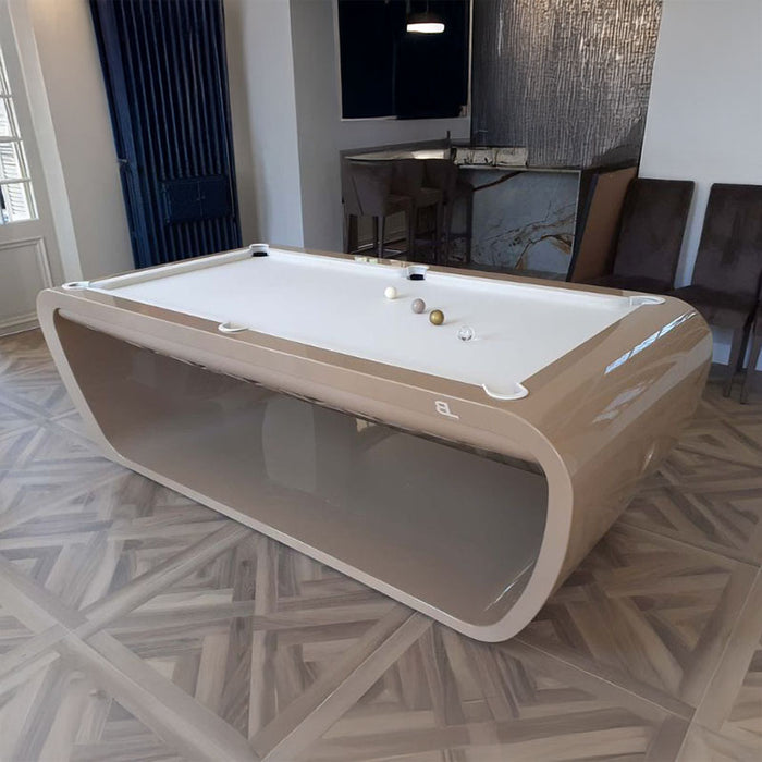 Contemporary beige Billards Toulet Blacklight pool table with white felt in a sophisticated residential interior.