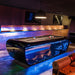 Luxurious Billards Toulet Blacklight pool tables with LED lighting in a modern lounge setting, ideal for upscale entertainment spaces.