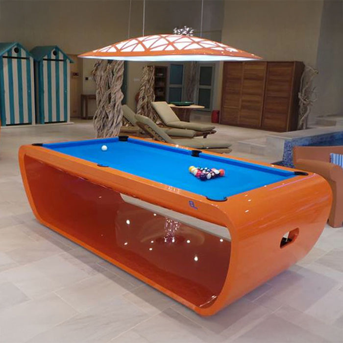 Vibrant orange Billards Toulet Blacklight pool table with bright blue felt in a playful recreational space with beach-inspired decor.