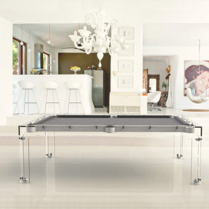 Billards Toulet Carat Light pool table with grey felt and glass structure in a bright white open-plan home with modern furnishings.