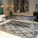 Glass Carat Light pool table with dark grey felt on a patterned rug in a contemporary vintage-themed room with decorative mirror.