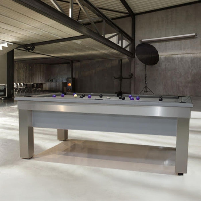 Modern industrial room featuring the sleek Billards Toulet Lambert Competition Pool Table with minimalist metal legs and vibrant ball setup, perfect for contemporary game rooms.