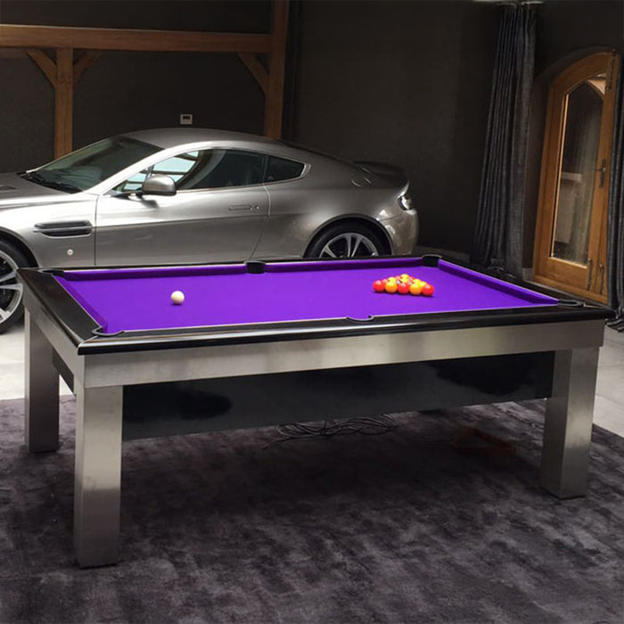 Luxurious garage setting with the Billards Toulet Lambert Competition Pool Table in bold purple cloth, placed beside a premium sports car for a high-end look.