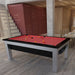 Industrial-chic dining and recreation area with a red-cloth Billards Toulet Lambert Competition Pool Table adding a bold splash of colour to the wooden interior.