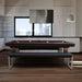 Luxury billiards table in a sleek city loft kitchen with skyline views, blending design with functionality.