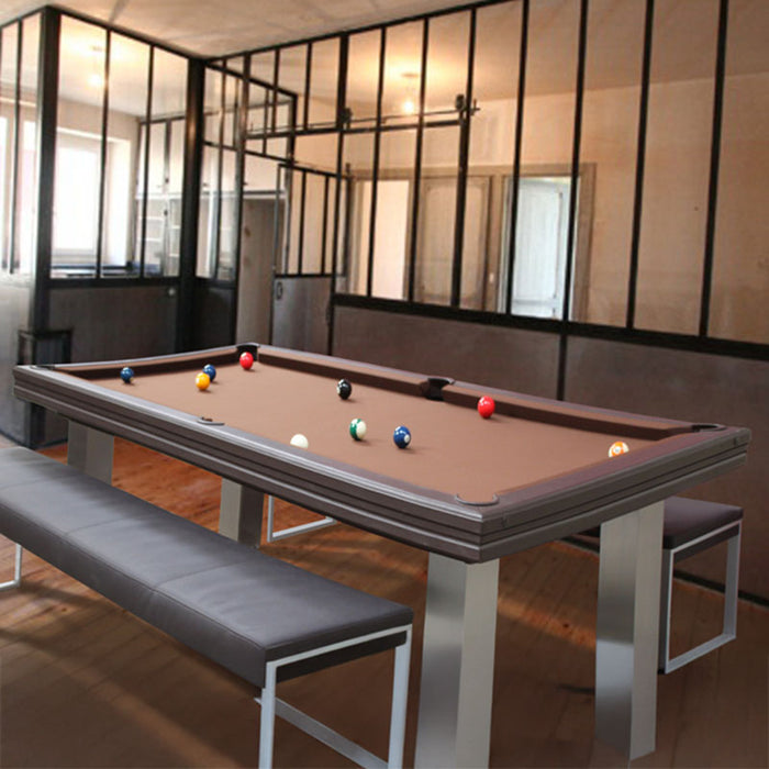 Designer pool table with brown felt in an industrial-style space, paired with sleek seating for versatile use.