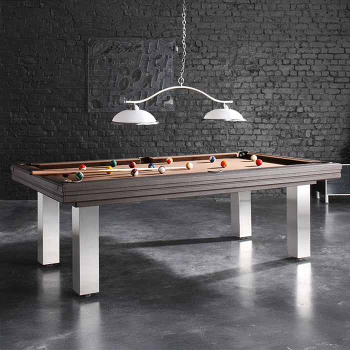 Stylish taupe pool table with contemporary legs in a minimalist loft with dark brick walls and pendant lights.