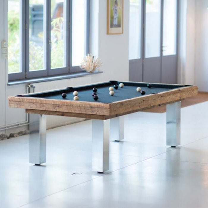 Bright, minimalist games room with Billards Toulet Megeve pool table featuring black cloth, chrome legs and rustic oak surround.