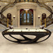 Dark Billards Toulet Whitelight pool table with white playing surface displayed in a lavish palace interior with ornate staircase and regal detailing.