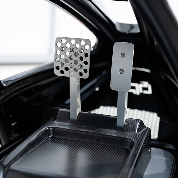 BPS Phoenix Commercial Racing Simulator aluminium throttle and brake pedals viewed from inside the carbon fibre cockpit floor