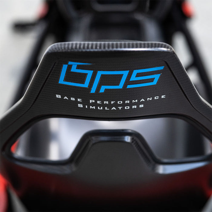 BPS Phoenix Commercial Racing Simulator overhead close-up of dashboard telemetry unit showing lap, gear, RPM data alongside carbon fibre BPS steering wheel