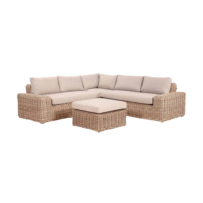 Front view of the Como Natural Antique Outdoor Corner Seating Set with spacious seating and a matching footstool, highlighting its natural rattan texture and inviting design.