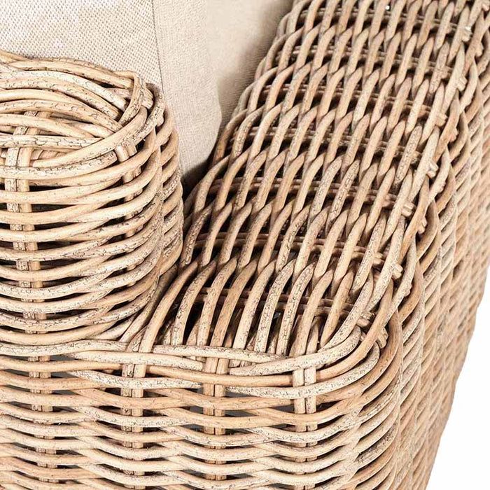 Detailed close-up of the woven synthetic rattan material used in the Como Natural Antique Outdoor Seating Set. The natural antique finish highlights the craftsmanship and texture of the design, paired with soft beige cushions for added comfort.