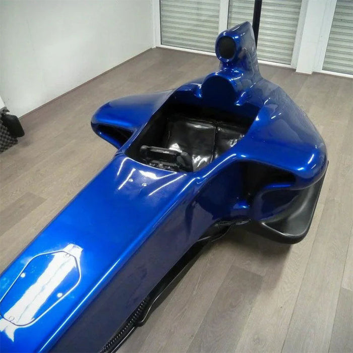 Cool Performance F1 Half Cockpit racing simulator with blue Formula-style bodywork, immersive single-seater design and realistic motorsport simulation cockpit.