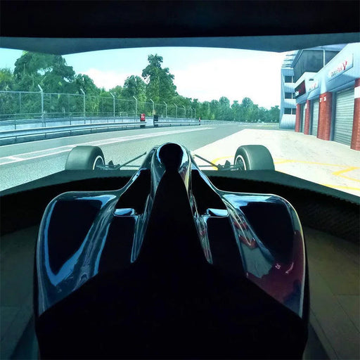 Cool Performance F1 Half Cockpit racing simulator displaying a realistic race track on a panoramic curved screen for an immersive Formula racing experience.