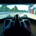 Cool Performance F1 Half Cockpit racing simulator displaying a realistic race track on a panoramic curved screen for an immersive Formula racing experience.