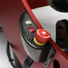 Cool Performance Formula Pro Racing Simulator carbon fibre side panel close-up showing red emergency stop button with yellow collar, chrome button, and red function button mounted on red chassis frame.