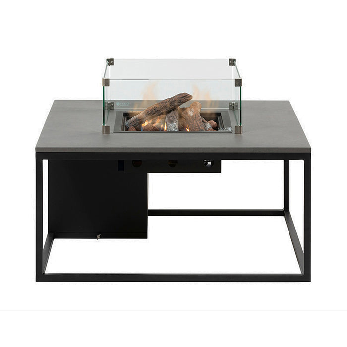 Cosiloft 100 Fire Pit Table's sleek black and grey fire pit table with a glass surround, featuring ceramic logs and a vibrant flame.