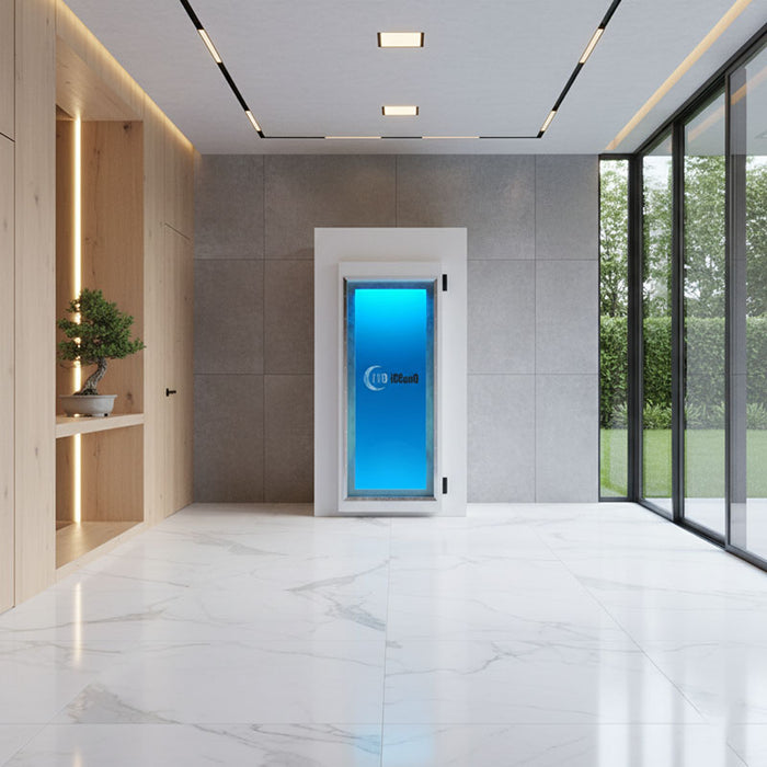 White Cryo-iCConiQ PRO electric cryochamber featured in a minimalist spa interior with natural light, combining cryotherapy with elegant design aesthetics.