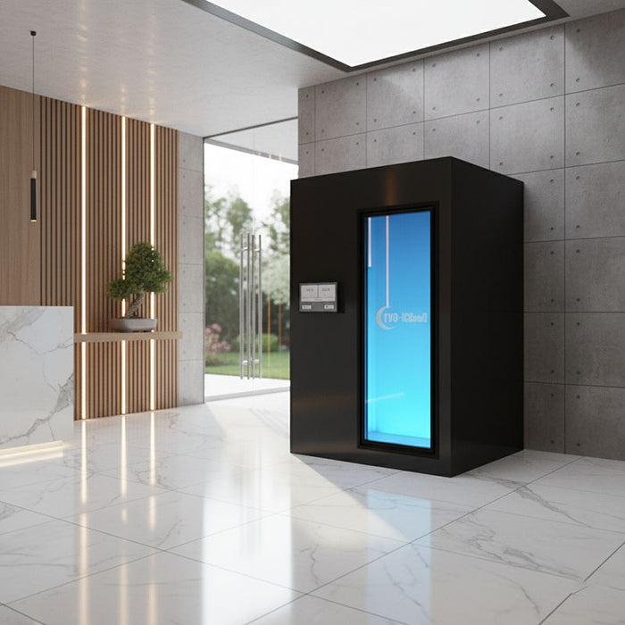 Cryo-iCConiQ PRO electric cryochamber with modern black exterior placed in a high-end reception area, suitable for clinical or hospitality cryotherapy offerings.