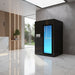 Cryo-iCConiQ PRO electric cryochamber with modern black exterior placed in a high-end reception area, suitable for clinical or hospitality cryotherapy offerings.