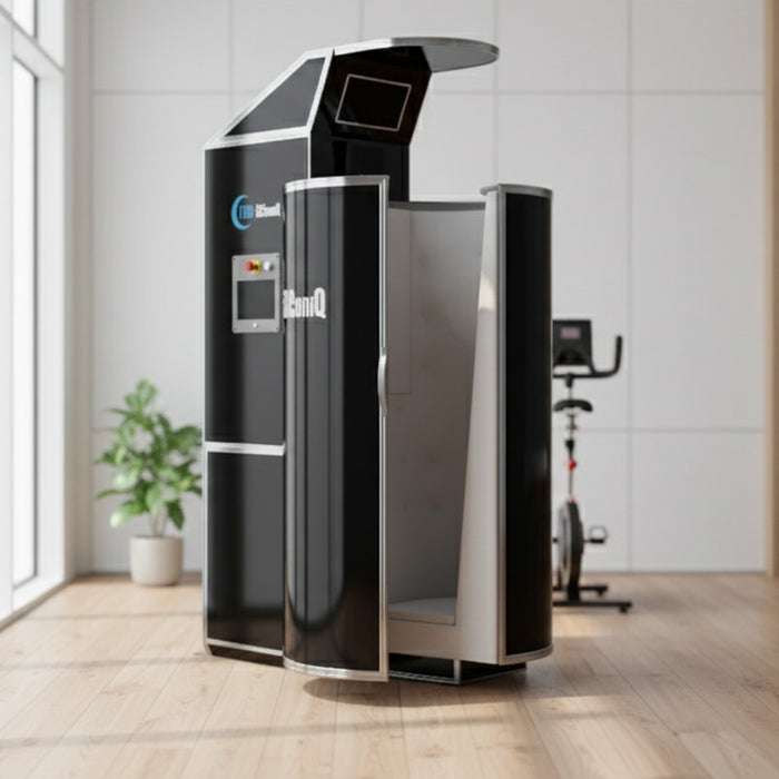 Cryo-iCConiQ SOLO nitrogen cryosauna positioned in a bright, modern wellness space with wood floors and large windows, offering cryogenic recovery in a clinical setting.