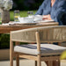 Rope chair of Denver Outdoor Dining Set in outdoor setting.