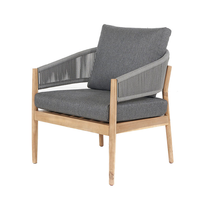 Side view of Denver Outdoor Seating Set's armchair in teak with grey cushion.