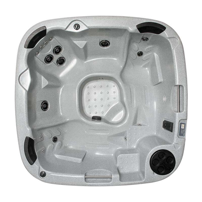 Top interior view of a light grey hot tub displaying seats and water jets