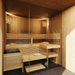 Luxurious Estholz Garden House WILLIAM interior featuring a modern wooden sauna with bench seating, soft lighting, and glass door enclosure.