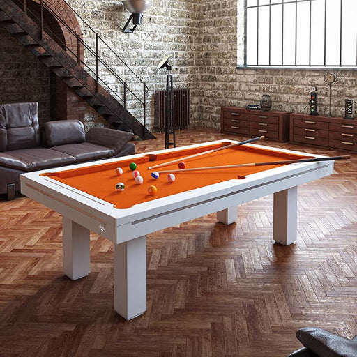 Etrusco Casino pool table with clean white frame and bright orange felt, placed in a stylish loft with brick walls and herringbone wood flooring.