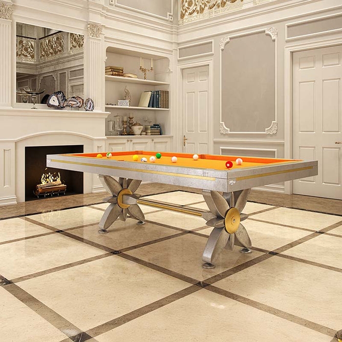 Etrusco Narciso pool table with bold orange cloth and metallic floral legs, standing out in a lavishly decorated classical room.