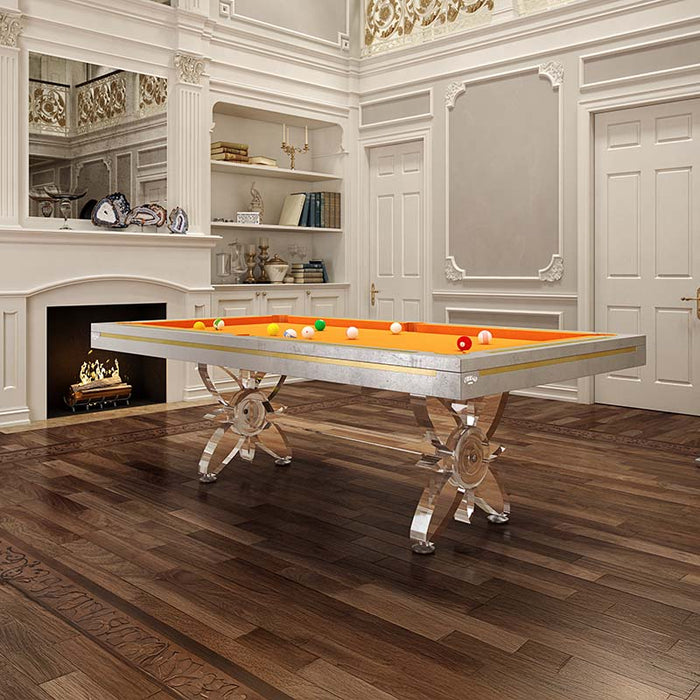 Etrusco Narciso pool table with bright orange cloth and shining chrome legs, displayed in a grand room with rich wooden flooring.