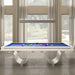 Front-facing view of the Etrusco Onda Marina Pool Table featuring blue felt and acrylic curved legs, set against large windows with elegant curtains.