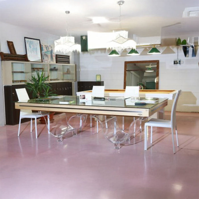 Etrusco Onda Marina Pool Table converted into a stylish glass-top dining table, featuring transparent wave-shaped legs and surrounded by modern white chairs.