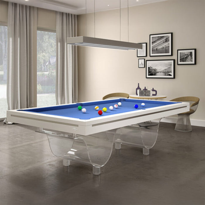 Etrusco Onda Marina Pool Table with bright blue cloth and clear wave-style legs, positioned in a modern room with natural light and framed wall art.