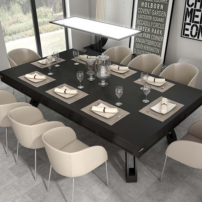 Etrusco P40 pool dining table in full black matte finish, elegantly transformed into a formal dining setup with beige chairs, fine tableware, and minimalist decor in a bright contemporary space.