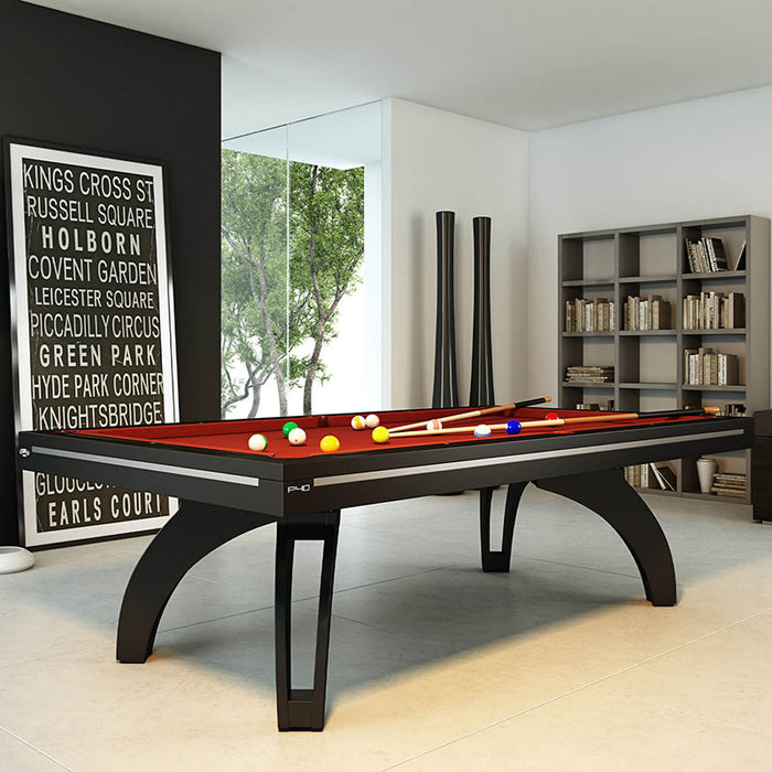 Etrusco P40 modern pool table in matte black finish with deep red cloth, displayed in a stylish home library setting with contemporary décor and clean architectural lines.