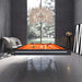 Etrusco P40 pool table in matte black frame with vibrant orange cloth and clear acrylic legs, placed under a grand chandelier in a striking monochrome-themed interior.