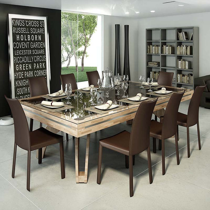 Etrusco P40 dining pool table with natural wood block finish and black glass top, set for fine dining in a contemporary interior with brown leather chairs and elegant place settings.
