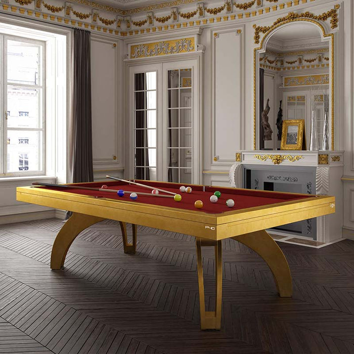 Etrusco P40 luxury pool table in golden finish with deep red cloth, styled in an opulent room with ornate mouldings and classic French decor, combining classic elegance with modern play