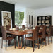 Etrusco P40 convertible dining pool table in rich walnut finish with a mirrored glass top, surrounded by brown leather chairs and styled in a refined, art-inspired space.