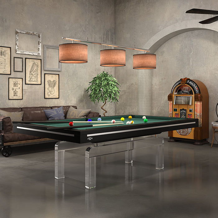 Elegant black Etrusco P50 pool table with green baize and see-through legs, styled in a rustic entertainment room.