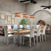 Convertible Etrusco P50 pool and dining table with wood finish, clear legs, and white chairs set up for a meeting.