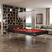 Modern Etrusco Smile pool table in black with red felt and transparent legs, placed in a refined library-inspired living room.